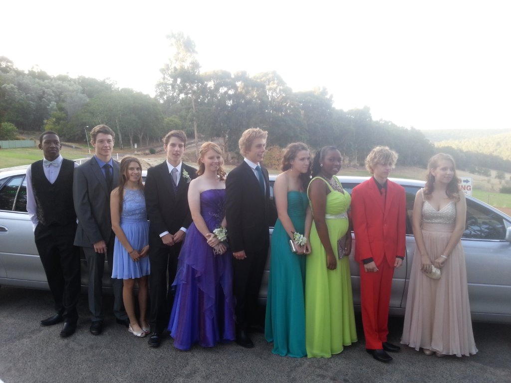 Pert Limo Hire with a lively and colourful school ball group .